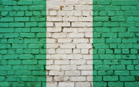 Flag of Nigeria painted on brick wall, background texture