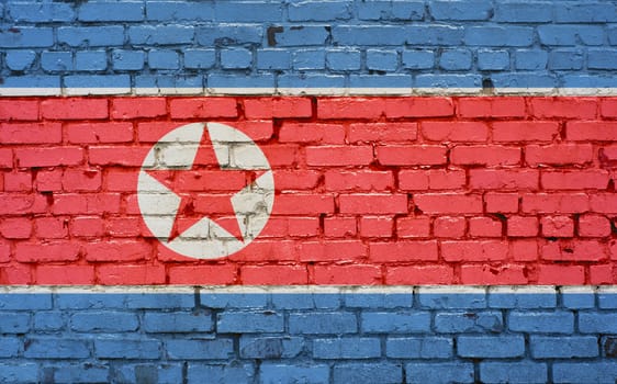 Flag of North Korea painted on brick wall, background texture