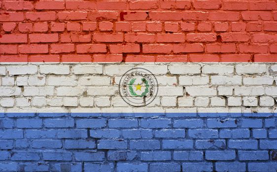 Flag of Paraguay painted on brick wall, background texture
