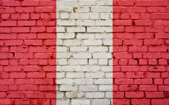 Flag of Peru painted on brick wall, background texture