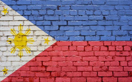 Flag of Philippines painted on brick wall, background texture