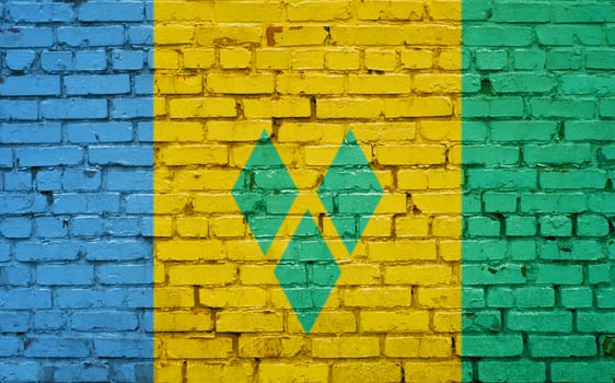 flag of Saint Vincent and Grenadines painted on brick wall