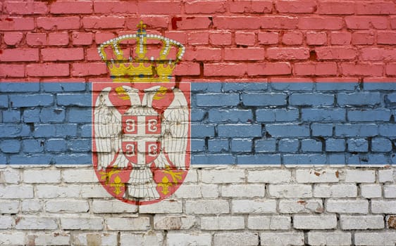 Flag of Serbia painted on brick wall, background texture