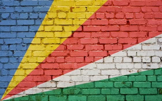 Flag of Seychelles painted on brick wall, background texture