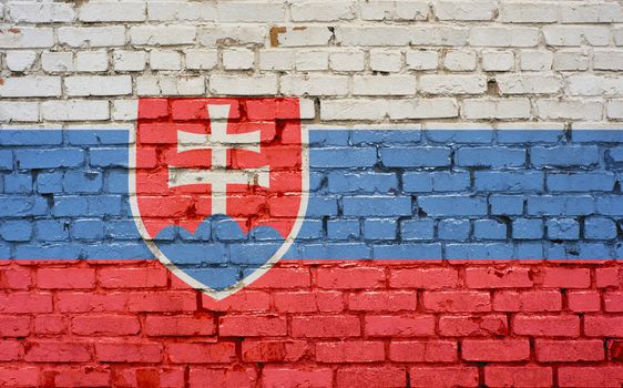 Flag of Slovakia painted on brick wall, background texture