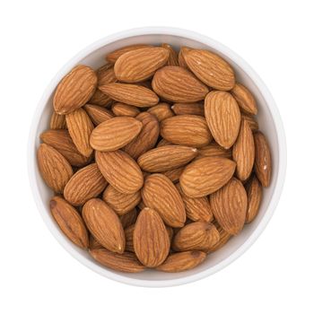 Almonds seed in the bowl isolated on white background.
