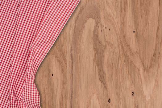 the checkered tablecloth on wooden table