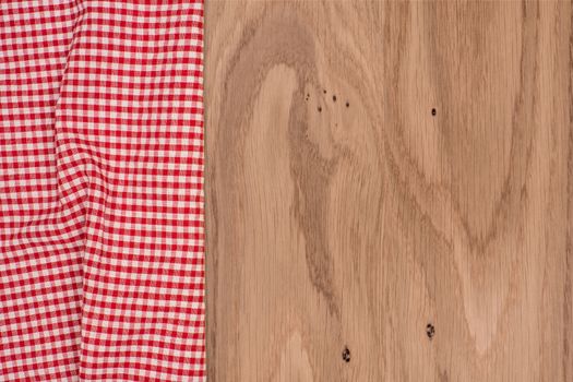 the checkered tablecloth on wooden table