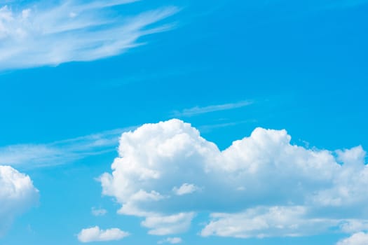 blue sky background with tiny clouds