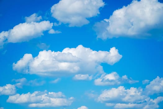 blue sky background with tiny clouds