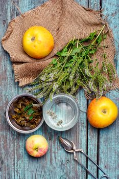 Herbal tea with fresh mint on wooden background