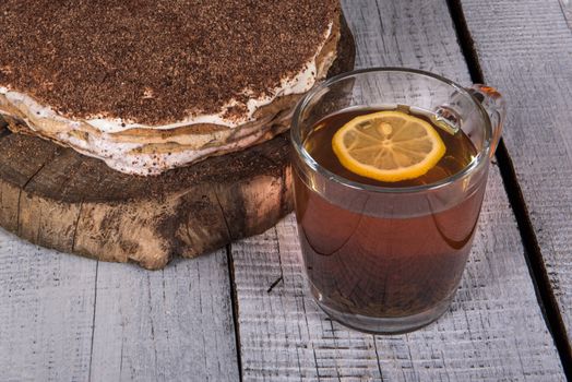 homemade nut cake in a tree with lemon tea