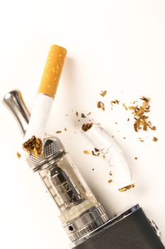 electronic cigarettes and tabacco on white background stop smoking message