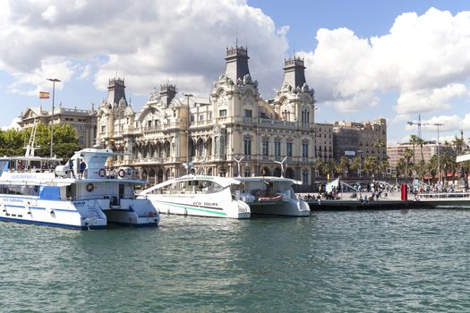 BARCELONA, SPAIN - MAY 11, 2016 : View  from the sea on Port Vell and Barcelona's old Customs building, Barcelona, Spain.It  is a waterfront harbor in city and part of the Port of Barcelona.16 million people visit the complex each year