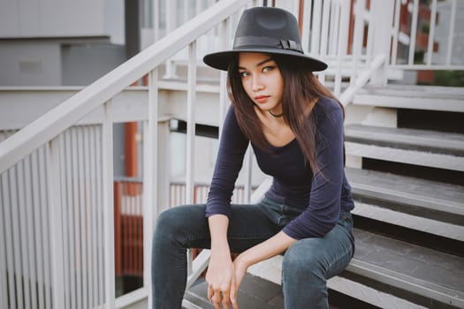 Beautiful asian young woman smiling on the city .