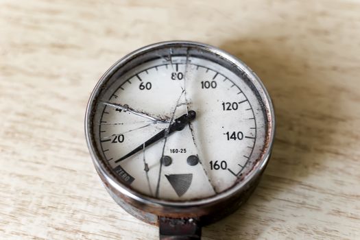 Pressure gauge with a broken glass closeup