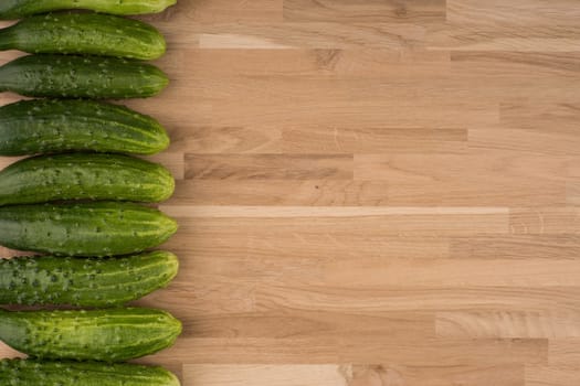 Cucumbers on a wooden background.