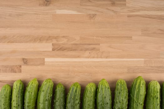 Cucumbers on a wooden background.