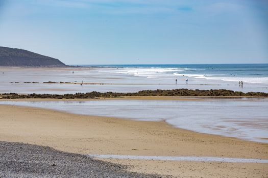 beach coastline sun sand ocean walk people France Normandy Hague