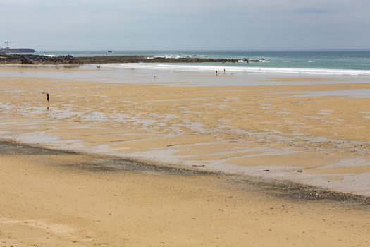 beach coastline sun sand ocean walk people France Normandy Hague