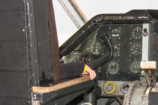Fun in the cockpit of an old propeller aircraft