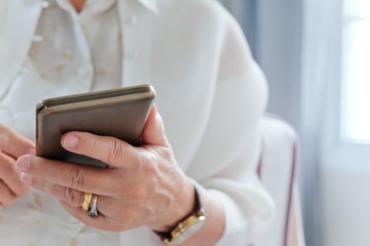 Senior woman using her mobile phone.