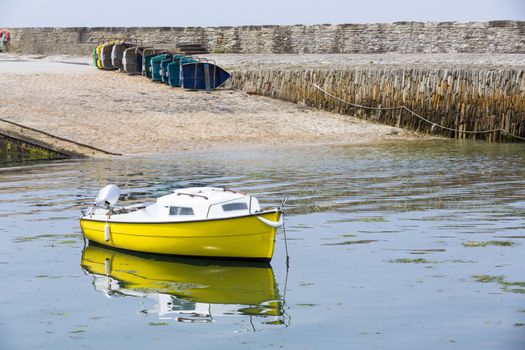 Small fishing boats waiting in port France water reflection