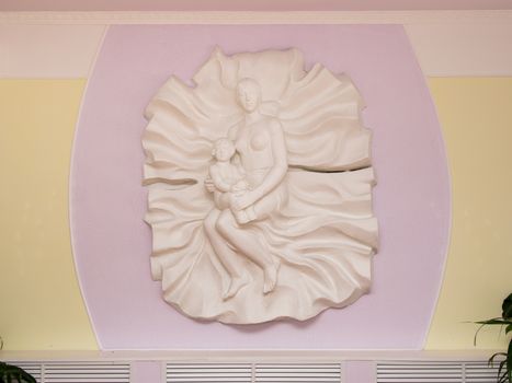 Volgograd, Russia - December 30, 2015: sculpture "Mother and Child" in the maternity hospital Discharge branch 4 Volgograd