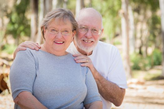 Happy Senior Couple Portrait Outdoors At Park.