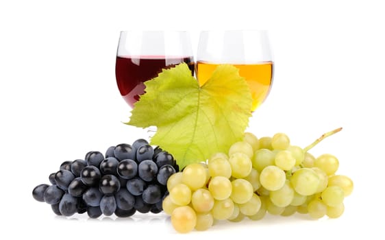 Branch of grapes and glass of wine isolated on white background