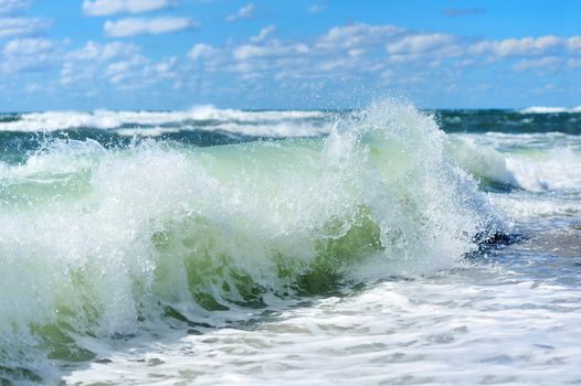 Beach Wave, view in the tube with beach in background