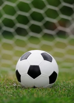 Close-up soccer ball on green grass