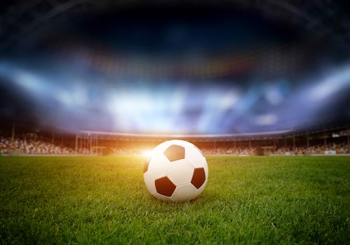 Soccer ball on the field of stadium with light