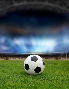 Soccer ball on the field of stadium with light