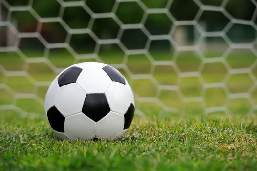 Close-up soccer ball on green grass