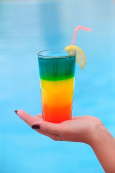Cocktail on the background of the pool