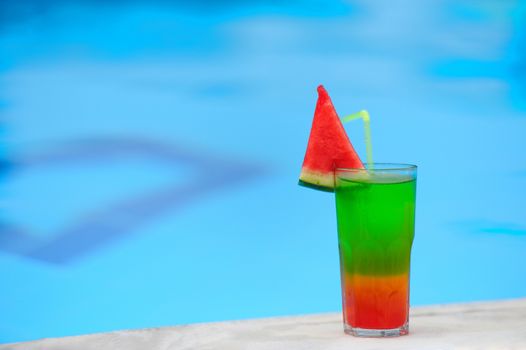 Cocktail on the background of the pool