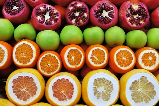 Set of fruits on the market from pomegranates and citrus