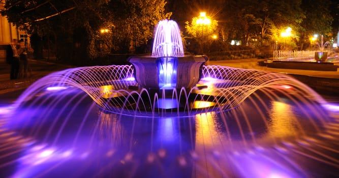 Colored water fountain at night