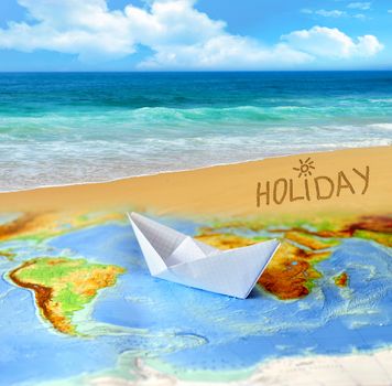 Paper boat on a background map of the world. Traveling concept