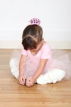 Little ballet girl dancing in the dance studio