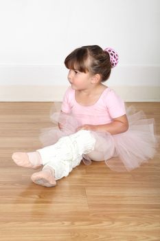 Little ballet girl dancing in the dance studio