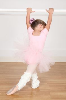 Little ballet girl dancing in the dance studio