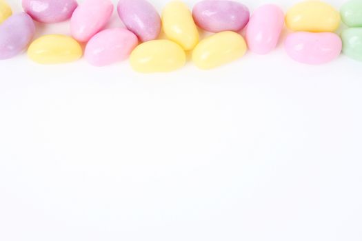 Multi coloured candies on a white background