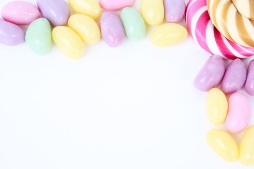 Multi coloured candies on a white background