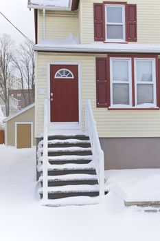 Yellow and red weatherboard home, Winter season