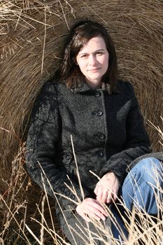 Adult brunette female in a rural setting