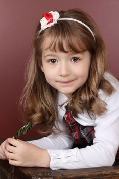 Beautiful little girl with a Christmas candy cane
