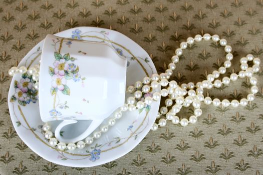 Antique tea cup with pearls