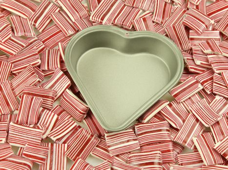 Heart tin, surrounded by candy and sweets